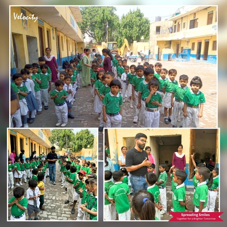 migrate 1771159689 Joyful interaction with students and staff during a School visit organized by Velocity